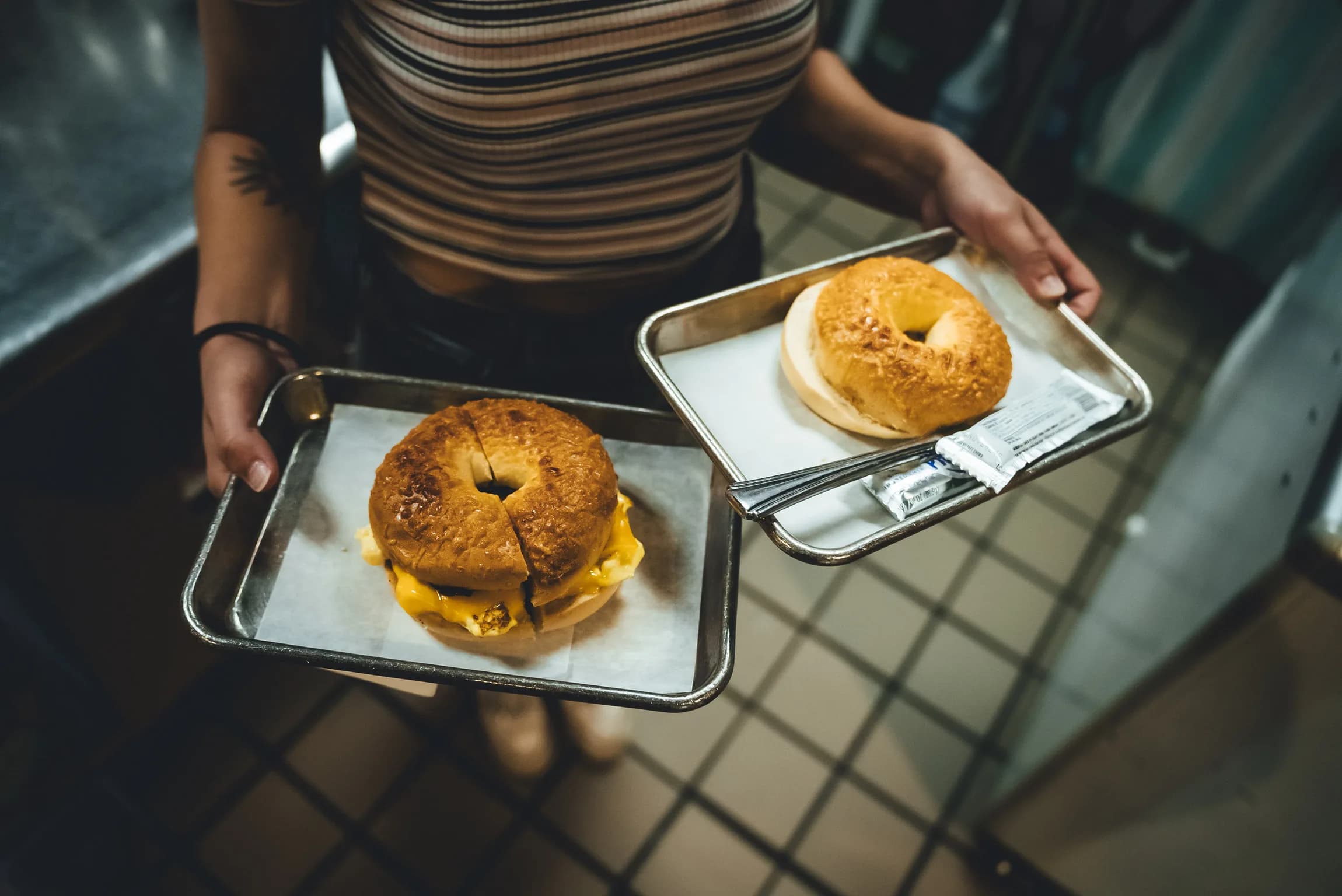 Corner Coffee bagel breakfast sandwiches served on two trays